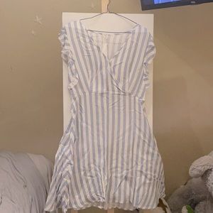 Mid length dress with blue stripes ruffle sleeves.